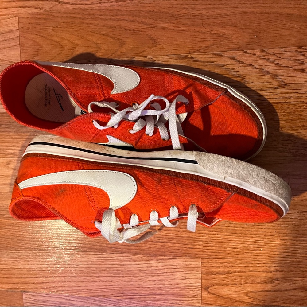 Men’s orange Nikes